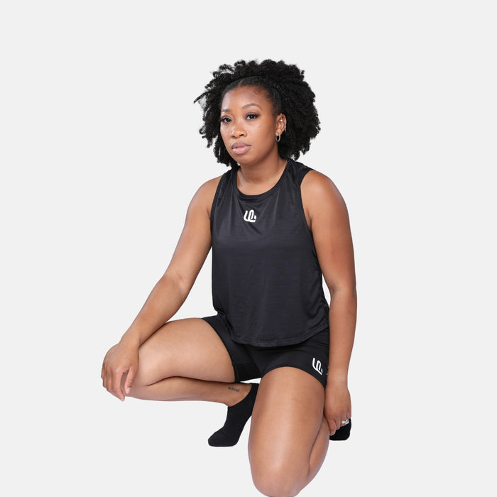 Woman wearing a black Unsponsored Life athletic tank